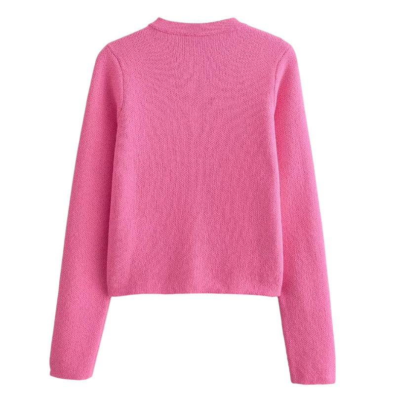 Pink Knit Gold Button-Down Long Sleeve Sweater for women and teens. Soft, cozy, and warm ribbed knitwear with elegant gold buttons. Feminine, chic, and trendy pink sweater inspired by Parisian fashion, coquette and preppy style, and clean girl aesthetics. Perfect for fall, autumn, and winter 2025 outfits. Ships globally and worldwide to the US, UK, Canada, Australia, Europe, and Asia.