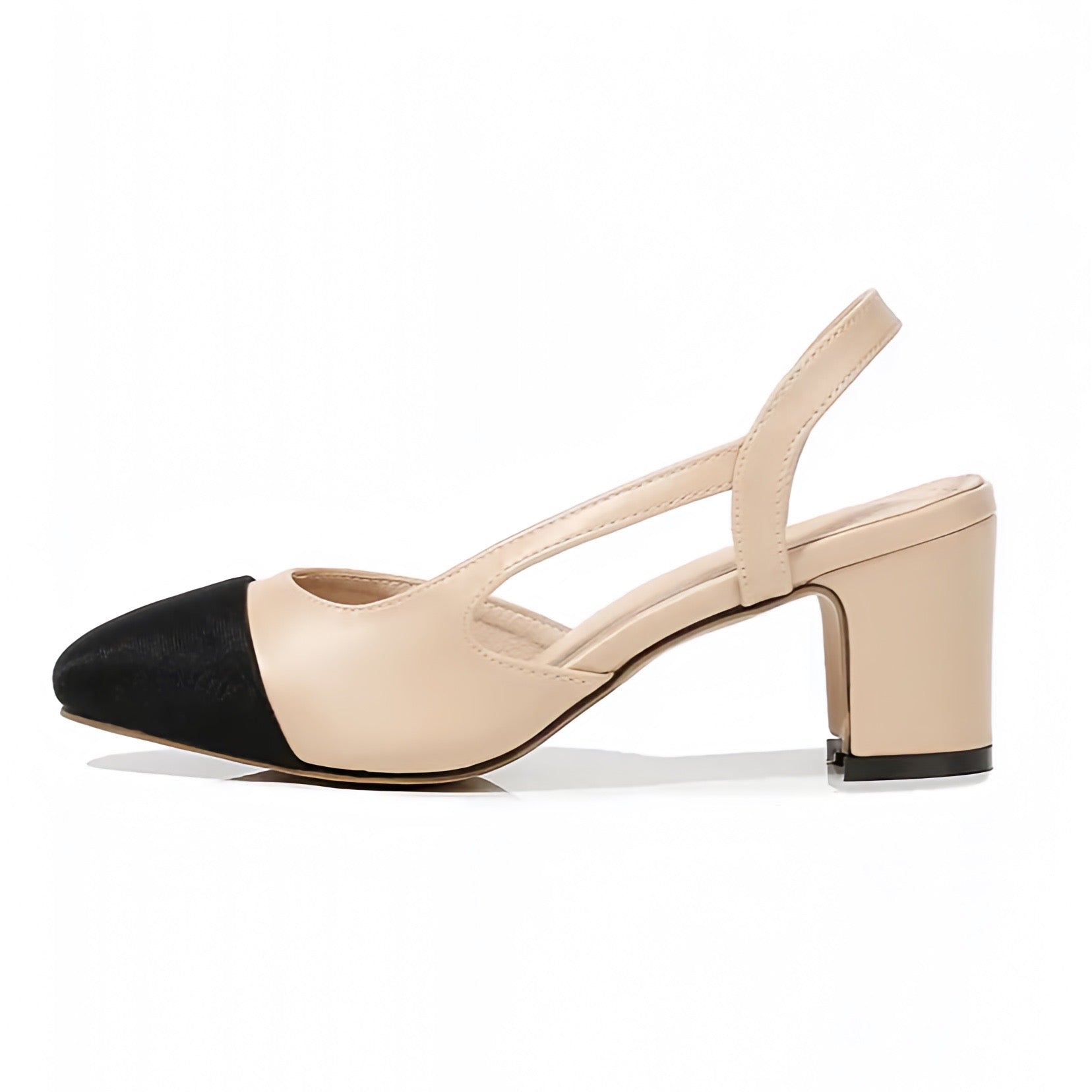 Beige and black contrast toe slingback mid-block ballet silhouette heels featuring a smooth faux leather finish and sleek almond toe. Designed with a cushioned insole and adjustable strap for comfort. Classic Parisian-inspired style with a minimalist aesthetic perfect for office, evening, or casual wear. Ships worldwide to the US, UK, Canada, Australia, New Zealand, and across Europe and Asia.
