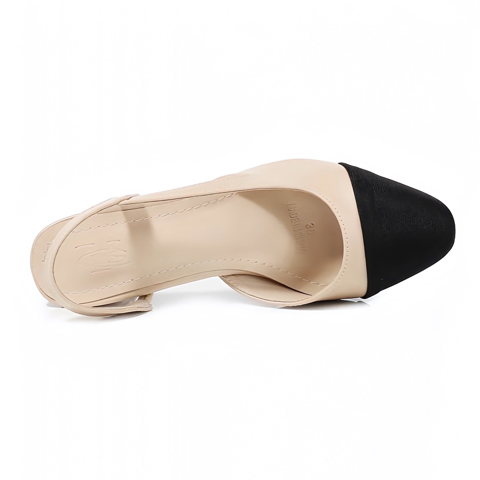 Beige and black contrast toe slingback mid-block ballet silhouette heels featuring a smooth faux leather finish and sleek almond toe. Designed with a cushioned insole and adjustable strap for comfort. Classic Parisian-inspired style with a minimalist aesthetic perfect for office, evening, or casual wear. Ships worldwide to the US, UK, Canada, Australia, New Zealand, and across Europe and Asia.

