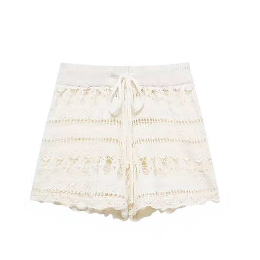 Beige eyelet embroidered knit crochet bohemian high-rise shorts for women, teens, and ladies. Cream white scalloped knit woven embroidered patterned shorts with slim fit straight leg A-line style and drawstring waist. Chic summer medium-length shorts for holiday, vacation, casual everyday fashion, boho chic, Ibiza style, Euro summer, resort wear, coastal style, coastal granddaughter, Hamptons style, Nantucket preppy beach looks. Perfect as swimsuit cover, rave, festival, concert, beach club fashion.