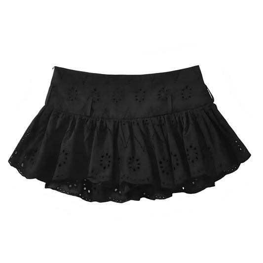 Black eyelet embroidered ruffle trim low-rise mini skirt for women, teens, and ladies. Floral patterned slim fit A-line skirt with sheath, drop waist, layered ruffle trim, pleated, tiered, flared, peplum, and flowy tutu silhouette. Short black mini skort style perfect for 2025 summer, holidays, vacations, everyday casual fashion, chic boho chic, Ibiza style, Euro summer, Stockholm style, Hamptons or Nantucket preppy coastal resort wear, evening party, sorority rush, sexy going out, festival & concert outfit