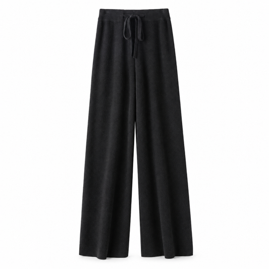 Black knit wide leg fleece pants for women with soft sweater-knit construction, ribbed fitted drawstring mid-rise waistband, relaxed baggy fit and full-length draped wide legs. Warm cozy elevated loungewear and knit trousers for fall winter 2026, minimalist, quiet luxury, casual chic, old money, Scandi, Stockholm, Copenhagen, Parisian, preppy, airport, travel, college, school, streetwear, clean girl, model off duty and everyday outfits.
