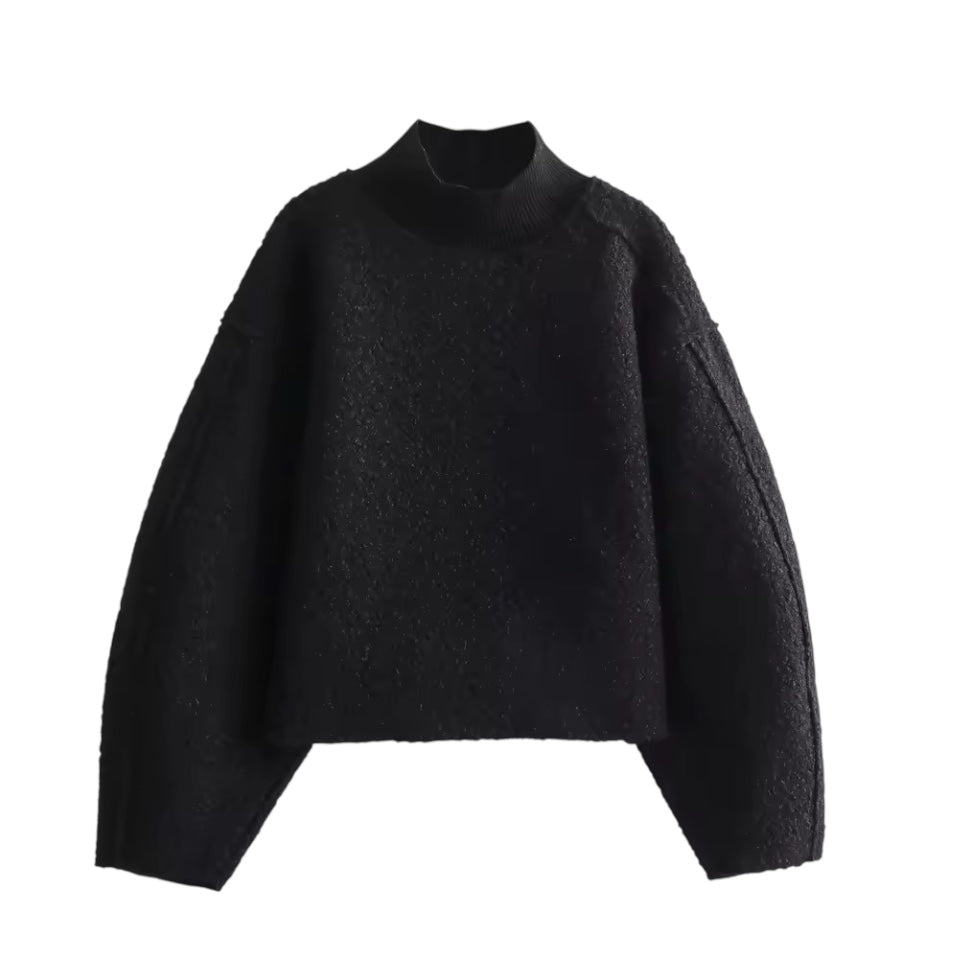 Black teddy knit balloon sleeve mock neck cropped fleece pullover for women featuring plush sherpa style fleece texture, chunky knit construction, ribbed mock neckline, oversized balloon sleeves and relaxed fit. Cozy all-black winter pullover ideal for UGGs outfits, Scandinavian Stockholm style, apres ski, snow trips, everyday casual and chic cold weather fashion. Ships worldwide.