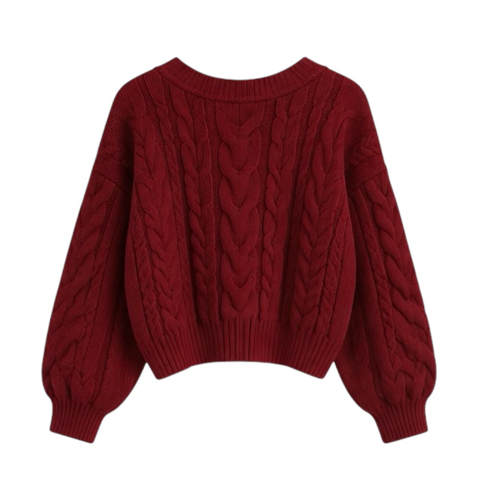 Burgundy red cable knit v-neck cropped long sleeve sweater for women featuring soft chunky knit fabric with woolen texture, ribbed cuffed sleeves, lightweight yet warm and breathable construction, and relaxed oversized fit. Cozy red knitwear jumper perfect for autumn, fall, and winter 2025 and 2026, Scandinavian Stockholm style, minimalist everyday outfits, school and university fashion. Ships worldwide.