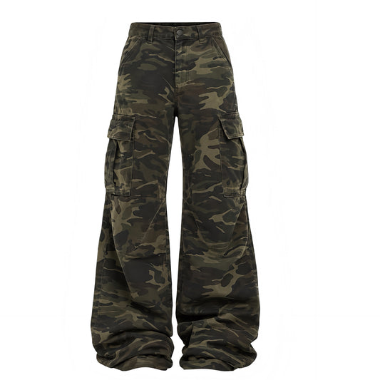 Front view women’s faded dark camouflage low-rise wide leg cargo pants with brown olive woodland camo print, low waist, oversized baggy fit, extra wide legs, cargo side flap pockets, front pockets, belt loops, button zip fly and floor-length puddle hem. Y2K 2000s, 90s, vintage military, army, utility, parachute, grunge, punk, baddie, rave, festival, concert and streetwear trousers for Fall Winter 2026.

