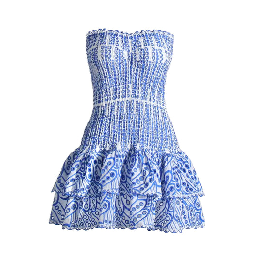 Capri blue and white striped floral anglaise eyelet embroidered strapless smocked mini dress with layered ruffle trim and tiered flared skirt. Slim fit bodycon corset bustier silhouette with ruched shirred detailing. Chic summer sundress for womens teens ladies perfect for party dress prom hoco homecoming graduation beach vacation ibiza style boho chic resort wear coastal granddaughter aesthetic loveshackfancy dupe zimmerman dupe.