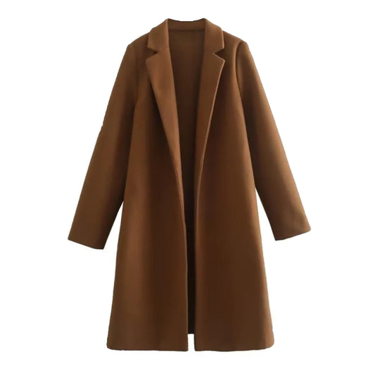 Chocolate brown woolen oversized trench coat for women, featuring warm wool blend fabric, wide lapel collar, double-breasted button closure, long sleeves, structured tailoring, minimalist neutral brown shade, elevated fall and winter outerwear for everyday fashion, old money luxury style, office wear, evening outfits, and travel. A chic high street trench coat shipped globally including US, UK, Canada, Australia, Europe and international destinations.