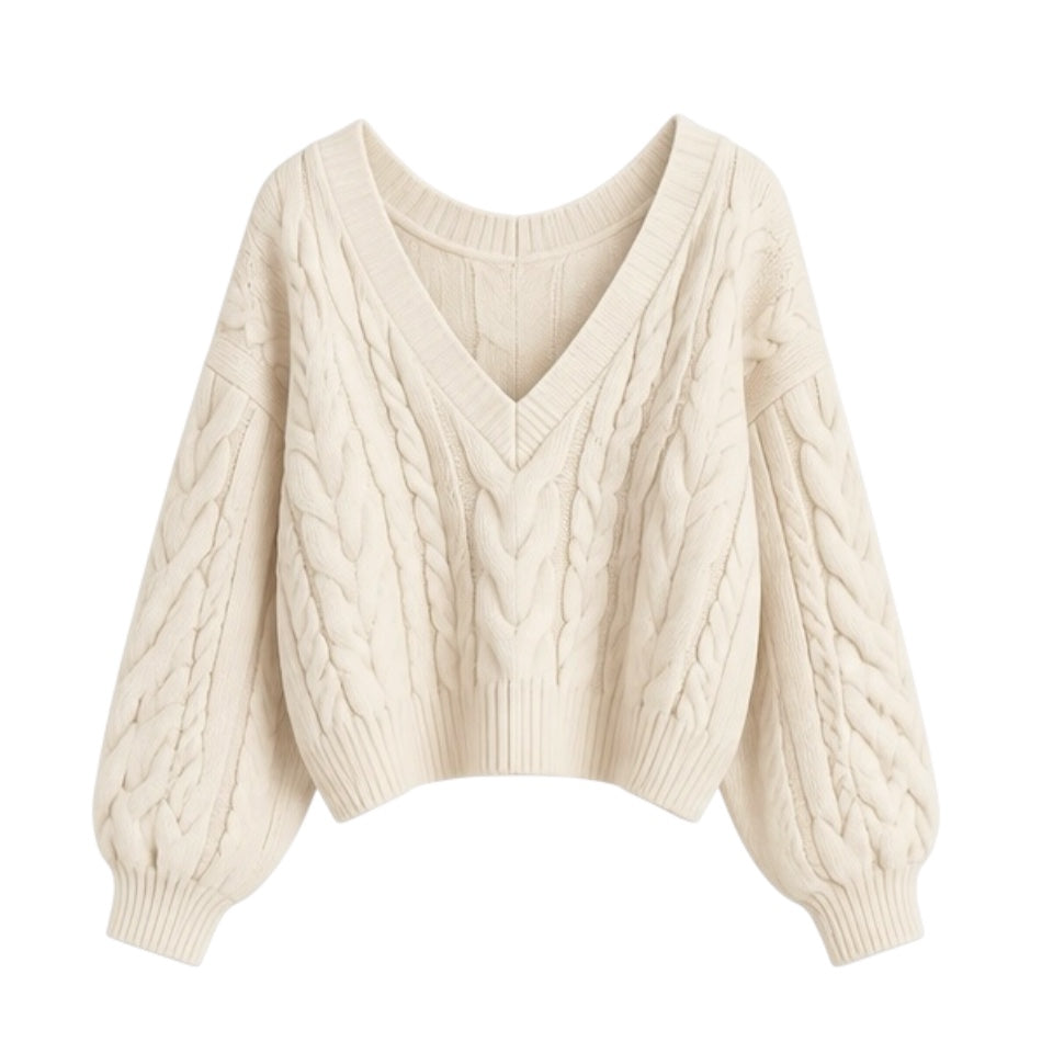 Cream white cable knit v-neck cropped long sleeve sweater for women featuring soft chunky knit fabric with woolen texture, ribbed cuffed sleeves, lightweight yet warm and breathable construction, and relaxed oversized fit. Cozy off white and beige knitwear jumper perfect for autumn, fall, and winter 2025 and 2026, Scandinavian Stockholm style, minimalist everyday outfits, school and university fashion. Ships worldwide.