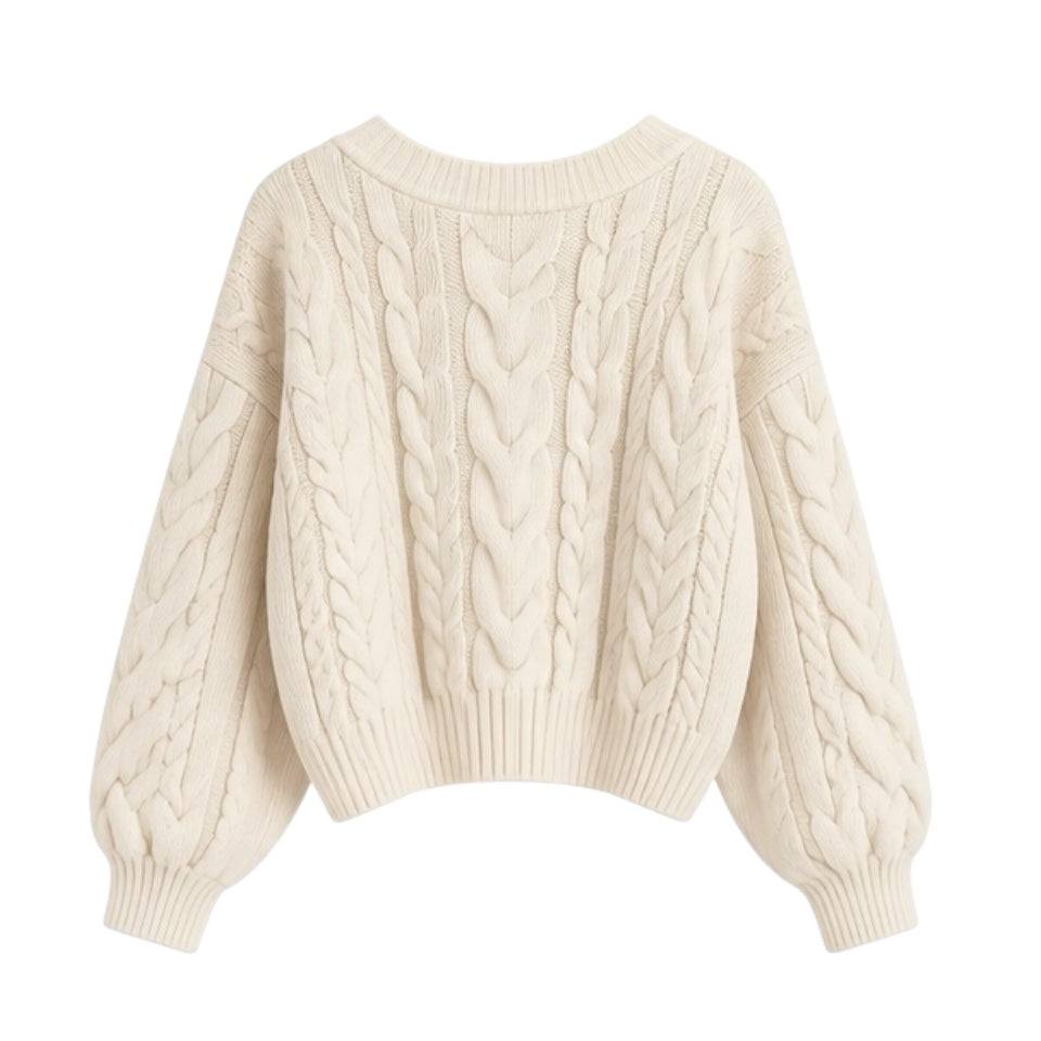 Cream white cable knit v-neck cropped long sleeve sweater for women featuring soft chunky knit fabric with woolen texture, ribbed cuffed sleeves, lightweight yet warm and breathable construction, and relaxed oversized fit. Cozy off white and beige knitwear jumper perfect for autumn, fall, and winter 2025 and 2026, Scandinavian Stockholm style, minimalist everyday outfits, school and university fashion. Ships worldwide.