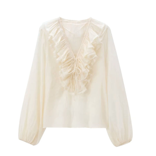 Cream white layered ruffle trim V-neck bohemian long sleeve blouse top for women, teens, and ladies. Off white beige linen slim fit sheath-style blouse with feminine ruffle detailing, crop cut, chic silhouette, and elegant everyday design. Perfect for 2025 summer and fall fashion, everyday casual outfits, evening looks, festivals, concerts, Euro summer, Ibiza style, beach vacations, boho chic, Stockholm streetwear, retro western flair, preppy Hamptons style, and Nantucket coastal fashion. Ships worldwide
