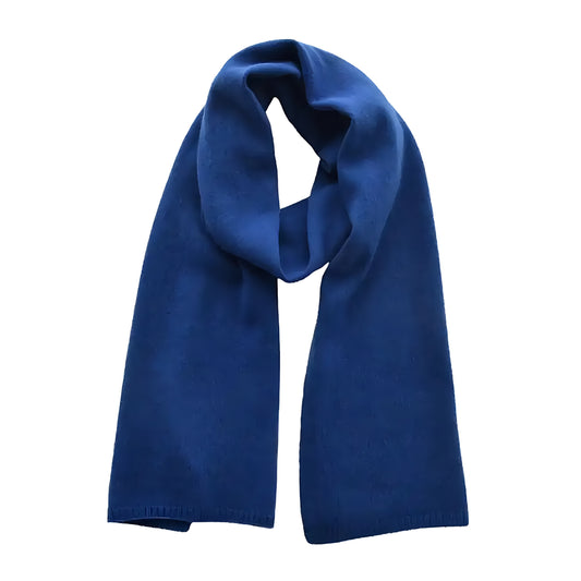 Dark blue oversized knit wool scarf for women made from soft plush wool blend yarn with a thick, cozy, chunky knit design. Elegant navy blue color adds timeless sophistication and warmth to winter wardrobes. Perfect for layering with coats, sweaters, or cold-weather outfits. Feminine minimalist knitwear inspired by Scandinavian fashion. Ships worldwide to US, UK, Canada, Australia, New Zealand, Europe, and Asia.