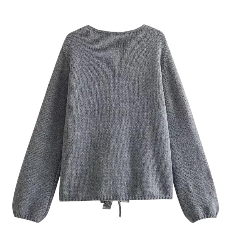 Dark Grey Knit Oversized Bow V-Neck Long Sleeve Cropped Cardigan Sweater for women and teens. Soft, lightweight, cozy knitwear with sparkly bow embellishments and relaxed oversized fit. Elegant and trendy coquette, Y2K, and soft girl aesthetic cardigan perfect for fall, winter, and holiday outfits. Chic Scandinavian-inspired knitwear. Ships globally and worldwide to US, UK, Australia, Canada, Europe, and Asia.