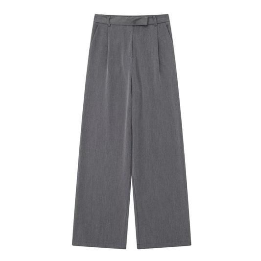 Dark grey low-rise pleated tailored straight leg trouser pants for women featuring a smooth woven suit fabric, structured fit, and elevated minimalist design. These full-length sleek trousers blend Scandinavian simplicity with timeless tailoring. Perfect for modern office wear, evening looks, or capsule wardrobe outfits. Inspired by European fashion and Stockholm style. Ships globally and worldwide to US, UK, Canada, Australia, and across Europe and Asia.