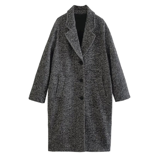 Dark grey twill wool trench coat for women featuring oversized relaxed fit, single breasted black button closure, wide lapel collar, long sleeves, structured tailored shape, insulated warm wool blend fabric, front welt pockets, minimalist neutral winter streetwear fashion and elegant old money outerwear, shipped globally worldwide.