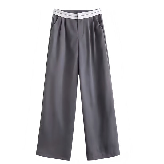 Dark grey and white mid-rise pleated tailored straight leg trouser pants for women featuring a sporty contrast waistband and smooth woven suit fabric. Sleek, structured, and fashion-forward with a sport-luxe aesthetic. Perfect for modern minimalist, Scandinavian, and office siren styles. Ideal for everyday, evening, or capsule wardrobe looks. Ships globally and worldwide to the US, UK, Canada, Australia, Europe, and Asia.