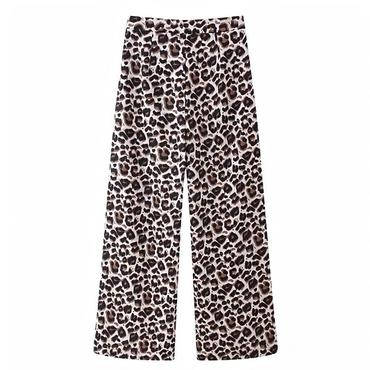 Leopard print vintage mid-rise wide leg trouser pants for women featuring a soft structured fabric, animal cheetah print pattern, and full-length relaxed silhouette. These brown and black patterned trousers are inspired by vintage and Y2K fashion, offering a chic, trendy, and timeless look. Perfect for streetwear, festivals, and elevated everyday outfits. Ships globally and worldwide to the US, UK, Canada, Australia, and all major European countries.
