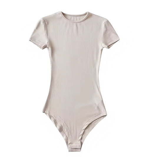 Light beige bodycon short sleeve bodysuit in a soft cotton blend fabric with seamless stretch and a flattering slim fit silhouette. Features a crewneck neckline, short sleeves, and sleek minimalist design. Perfect for layering or as a neutral everyday top for casual, chic, and feminine outfits. Ships globally to the US, UK, Canada, Australia, New Zealand, Europe, Asia, Germany, France, and more.

