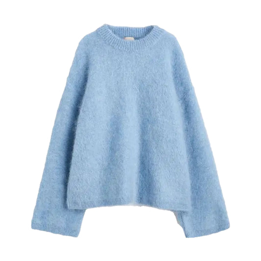 Light blue knit woolen oversized long sleeve pullover sweater for women and teens. Soft, cozy, fuzzy, and thick knitwear with crewneck round neckline and baggy relaxed fit. Sky blue chunky wool jumper perfect for fall, autumn, and winter 2025. Feminine, elegant, and trendy Scandinavian preppy fashion inspired by Copenhagen and Stockholm street style, coastal granddaughter, and clean girl aesthetic. Ships globally to the US, UK, Canada, Australia, New Zealand, Europe, Asia, France, Germany, Italy, Spain.