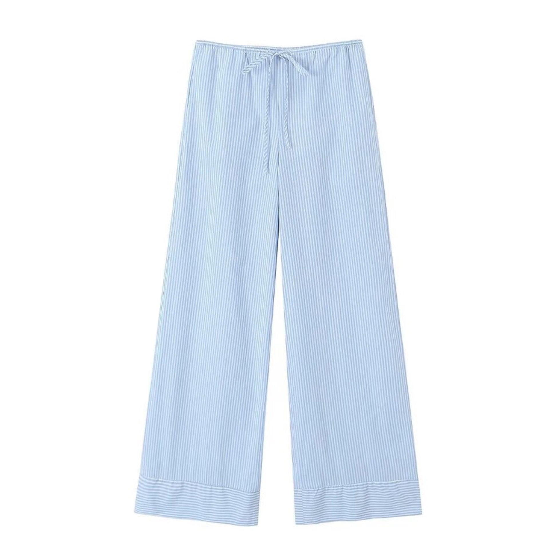 Light blue striped seersucker low-rise linen pants for women with soft breathable cotton blend fabric, adjustable drawstring waistband, and full-length relaxed fit silhouette. Lightweight and comfy coastal resort wear perfect for beach vacations, travel, or casual everyday outfits. Classic nautical pinstripe design in baby blue and white. Ships globally to the US, UK, Canada, Europe, Australia, and Asia.