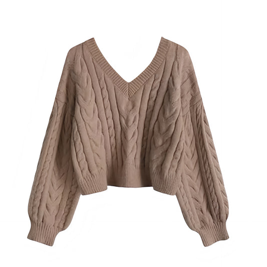 Light brown cable knit v-neck cropped long sleeve sweater for women featuring soft chunky knit fabric with woolen texture, ribbed cuffed sleeves, lightweight yet warm and breathable construction, and relaxed oversized fit. Cozy mocha and chocolate brown knitwear jumper perfect for autumn, fall, and winter 2025 and 2026, Scandinavian Stockholm style, minimalist everyday outfits, school and university fashion. Ships worldwide.