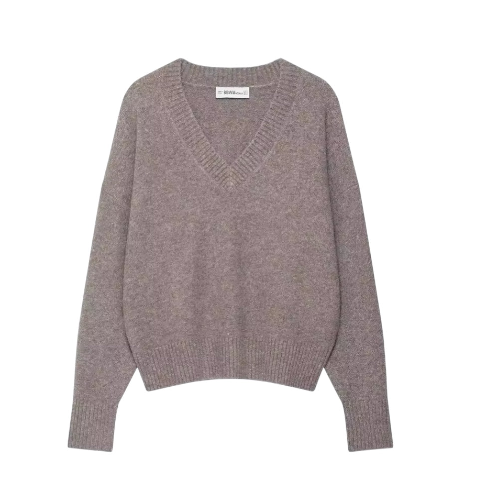 Light brown knit v-neck cropped long sleeve sweater for women featuring soft chunky knit fabric with woolen texture, breathable lightweight yet warm construction and relaxed oversized fit. Cozy mocha brown knitwear jumper perfect for autumn and winter 2025 and 2026, Scandinavian Stockholm style, minimalist everyday outfits, school and university fashion. Ships worldwide.