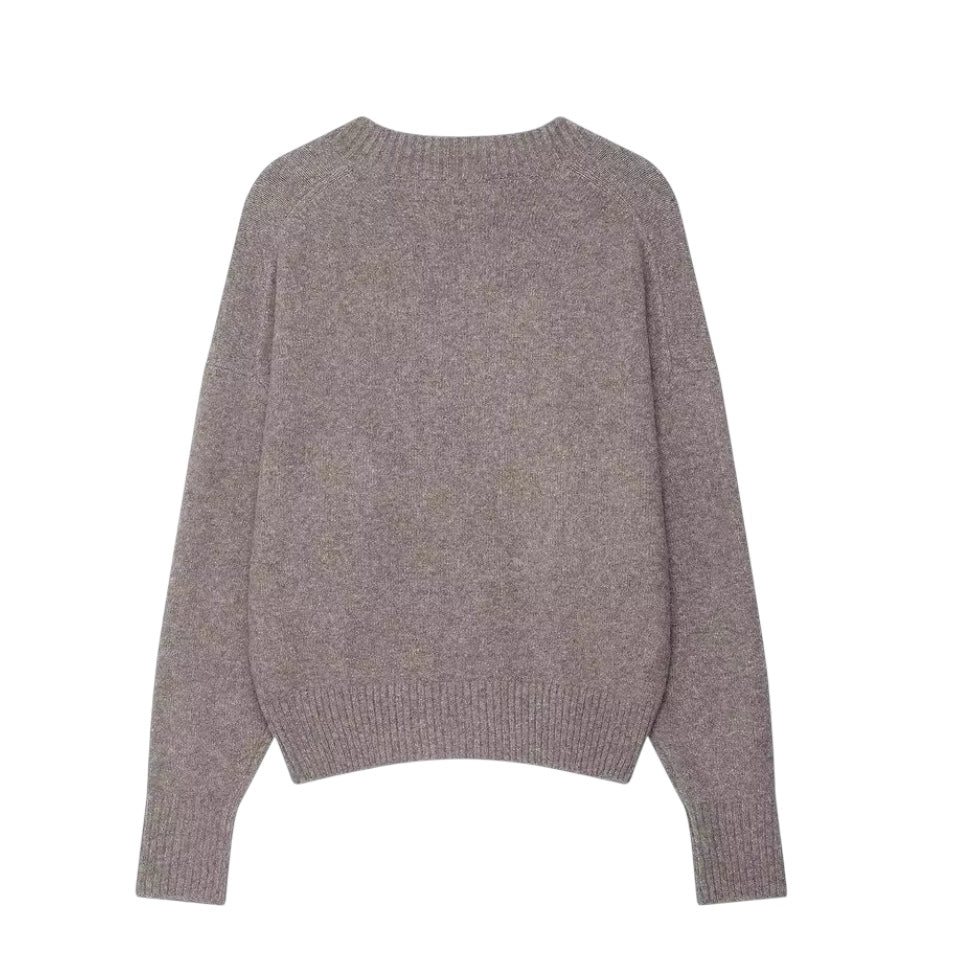 Light brown knit v-neck cropped long sleeve sweater for women featuring soft chunky knit fabric with woolen texture, breathable lightweight yet warm construction and relaxed oversized fit. Cozy mocha brown knitwear jumper perfect for autumn and winter 2025 and 2026, Scandinavian Stockholm style, minimalist everyday outfits, school and university fashion. Ships worldwide.