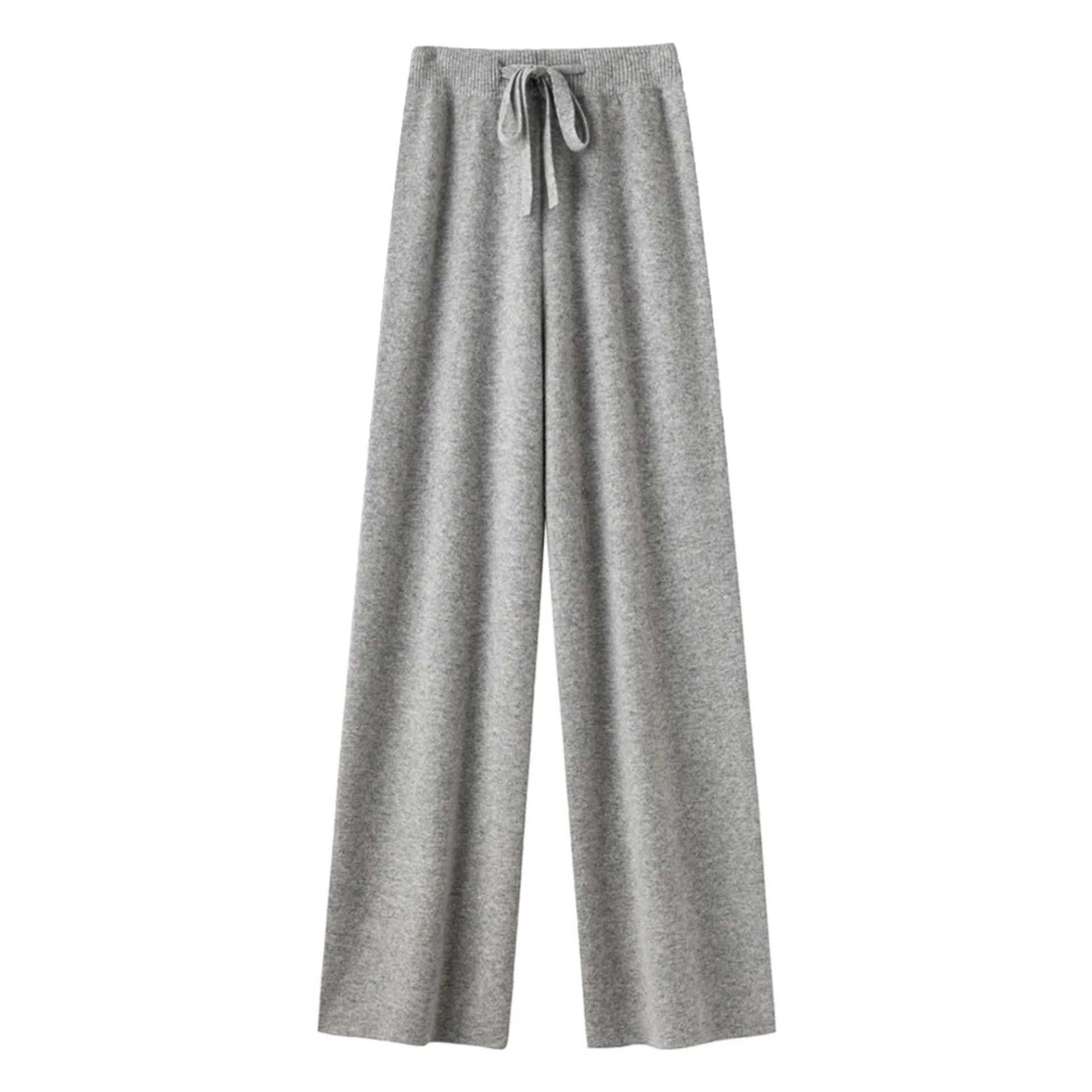 Light grey knit straight leg mid-rise lounge pants for women crafted from soft, cozy, and thick knitted fabric. These elegant knitwear trousers feature a full-length relaxed silhouette with a flattering straight leg fit. Perfect for casual, minimalist, or Scandinavian-inspired outfits, these lounge pants are ideal for everyday comfort, streetwear, or après-ski style. Ships globally and worldwide to the US, UK, Canada, Australia, and throughout Europe.