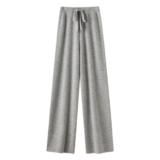 Light grey knit straight leg mid-rise lounge pants for women crafted from soft, cozy, and thick knitted fabric. These elegant knitwear trousers feature a full-length relaxed silhouette with a flattering straight leg fit. Perfect for casual, minimalist, or Scandinavian-inspired outfits, these lounge pants are ideal for everyday comfort, streetwear, or après-ski style. Ships globally and worldwide to the US, UK, Canada, Australia, and throughout Europe.