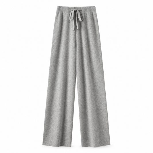 Light grey heather grey knit wide leg fleece pants for women with soft sweater-knit construction, ribbed fitted drawstring mid-rise waistband, relaxed baggy fit and full-length draped wide legs. Warm cozy elevated loungewear and knit trousers for fall winter 2026, clean girl, minimalist, Scandi, Stockholm, Copenhagen, quiet luxury, casual chic, old money, preppy, airport, travel, college, school, streetwear, model off duty and everyday outfits.

