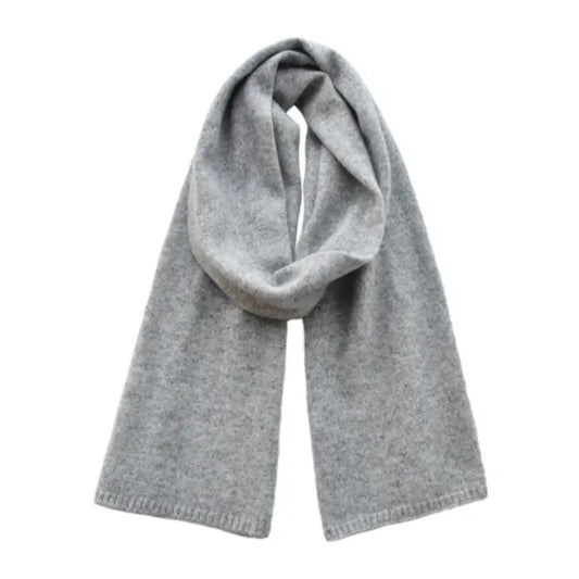 Light grey oversized knit wool scarf for women made from soft, plush wool blend yarn. Thick, cozy, and warm chunky knit texture perfect for layering and draping over coats and sweaters in fall and winter. Minimalist, elegant, and versatile neutral heather gray design ideal for casual and chic outfits. Luxury cold-weather accessory for women and teens. Ships globally to US, UK, Canada, Australia, New Zealand, and all of Europe and Asia.