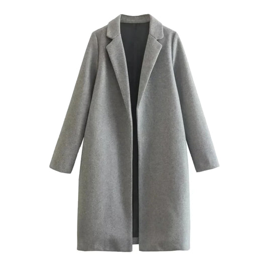 Light grey woolen oversized trench coat for women with wide lapel collar, long sleeves, relaxed tailored silhouette, soft cozy warm wool blend fabric, minimalist neutral winter outerwear, chic streetwear style jacket ideal for fall and winter fashion, ships globally to US, Canada, UK, Europe, Australia and more.