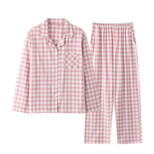 Light pink and white checkered cotton pajama set for women featuring a long sleeve button down collared top with front pocket and matching wide leg pants with pockets. Soft, breathable cotton blend fabric provides cozy comfort and feminine style. Lightweight, warm, and perfect for lounging, sleepwear, or holiday gifting. Inspired by Roller Rabbit and Eberjey. Ships globally to US, UK, Canada, Australia, New Zealand, Europe, and Asia.