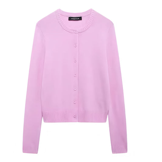 Light pink knit button-down long sleeve cardigan sweater for women and teens. Soft, cozy, lightweight knitwear with round neckline and cropped silhouette. Elegant and feminine pastel pink jumper perfect for fall, autumn, and winter 2025. Trendy coquette Y2K preppy style for everyday fashion. Chic, comfy, and casual knit cardigan for ladies. Ships globally to the US, UK, Canada, Australia, New Zealand, Europe, Asia, France, Germany, Italy, Spain, Denmark, Sweden, Switzerland, Netherlands, Poland, Ireland.