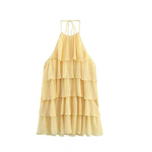Light yellow butter yellow layered ruffle trim sleeveless tiered backless halter mini dress with slim fit silhouette, plisse pleated flared A-line design, and elegant ruffled layers. Short sundress for women, teens, and ladies, ideal for summer and fall 2025 holidays, vacations, brunch, evening events, homecoming, hoco, school dances, parties, concerts, festivals, euro summer, boho chic, western cowgirl style, and preppy Stockholm fashion. Ships globally worldwide to US, Australia, New Zealand, UK, Canada.