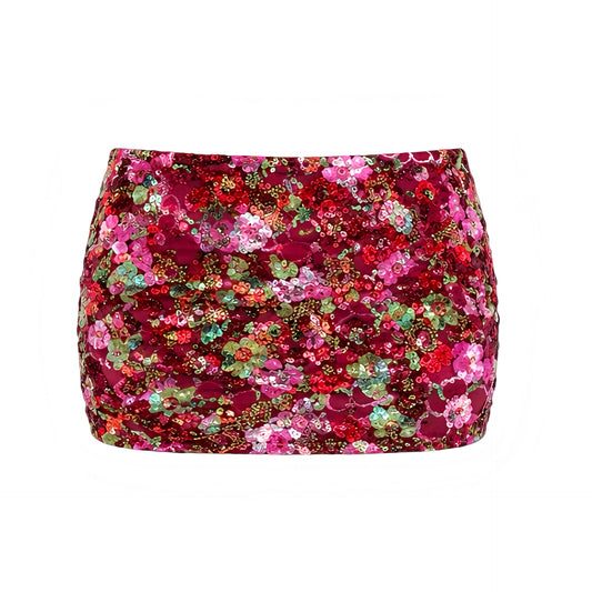 Mallorca multicolor sequin embellished slim fit low-rise mini skirt with pink, red and green patterned sequin detailing. Sparkly, shimmery, glittery and beaded short skirt with slim fit, bodycon, skinny fit, low rise, low-waisted, A line and pencil skirt styling. Perfect for women, teens and ladies, summer 2026, Y2K style, 2000s fashion, party outfits, night out outfits, going out outfits, club wear, clubbing outfits, disco outfits, disco parties, star girl aesthetic, NYE outfits, rave skirts, rave outfits.