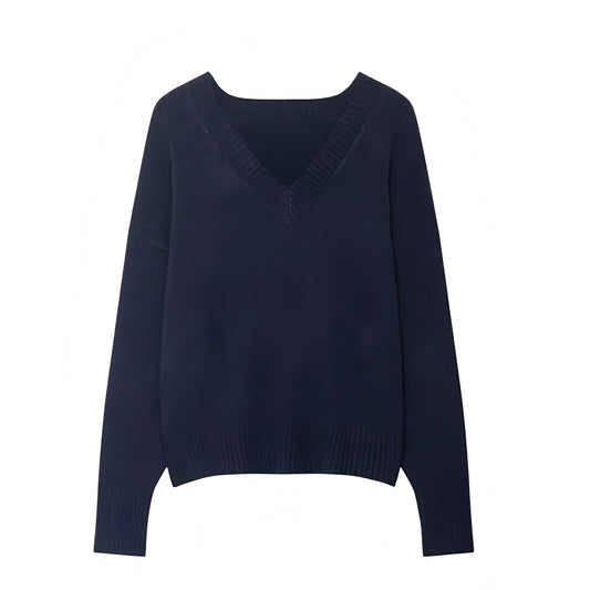 Navy blue knit v-neck cropped long sleeve sweater for women featuring soft chunky knit fabric with woolen texture, lightweight yet warm and breathable construction, and relaxed oversized fit. Cozy navy knitwear jumper perfect for autumn, fall, and winter 2025 and 2026, Scandinavian Stockholm style, minimalist everyday outfits, school and university fashion. Ships worldwide.