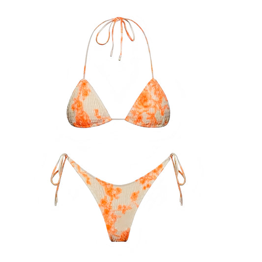 Orange & White Floral Print Ruched 2 Piece Triangle Bikini Set for women, teens, and ladies. Features bright orange and white floral patterned ruched ribbed triangle bikini top with wireless wire-free push up fit, v neck halter spaghetti straps, sleeveless backless string tie style, and matching bottoms in cheeky thong or full coverage. Feminine sexy Y2K chic trendy summer 2025 swimsuit, beach club, tropical Hawaii vacation, resort wear, and poolside swimwear. Ships globally to US, Australia, Europe 
