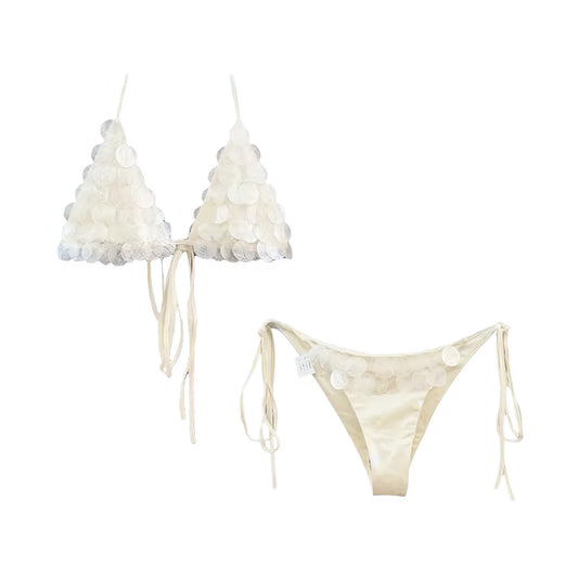 Pearl white sequin shell embellished beaded 2 piece triangle string bikini set in pearl white, off white, cream white, ivory. Sparkly sequined glittery shimmery slim fit skinny fit wireless wire-free push up bikini swimwear with halter tie neck, v neck triangle top, spaghetti straps, backless design, and cheeky thong or full coverage bottoms. Perfect for beach vacation, euro summer, Ibiza fashion, rave bikini, festival outfit, disco party, boho chic style, mermaidcore, tropicalcore, y2k aesthetic, coastal.