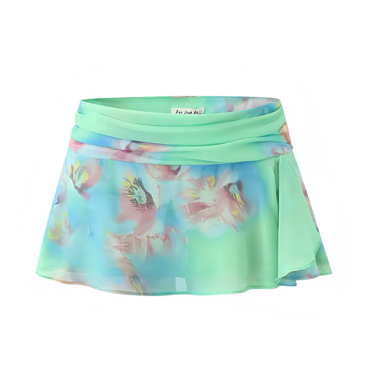 Tiana Multicolor Floral Print Ruffle Trim Low-Rise Mini Skirt. Green, blue, and pink tropical flower patterned skirt with slim fit silhouette, layered ruffle trim, flared A-line cut, and low-rise mini length. Feminine and trendy short skirt for women, teens, and ladies who love chic Y2K fashion, Euro summer outfits, Ibiza style, boho chic clothing, sorority rush, casual vacation looks, festival wear, rave style, sexy party outfits, and club wear. Ships worldwide to US, UK, Canada, Australia, Europe, Asia 