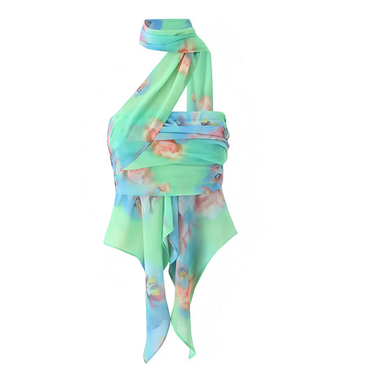 Tiana Multicolor Floral Print Ruffle Trim Sleeveless Halter Crop Top. Green, blue, and pink tropical flower patterned blouse featuring slim fit design, layered ruffle trim, sleeveless halter neckline with mock neck and turtleneck detail, and asymmetric cut. Feminine and trendy crop top for women, teens, and ladies who love Y2K fashion, chic Euro summer looks, sorority rush outfits, boho chic, Ibiza style, vacation wear, rave and festival fashion, sexy night out, and casual going-out club wear