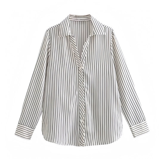White and black pinstriped linen shirt designed with a relaxed oversized fit, soft cotton blend, and breathable woven fabric. Features a collared v-neckline, single-breasted button down front, and long sleeves for an effortlessly chic silhouette. Perfect for coastal, minimalist, and Euro summer style. Ideal for vacation, resort wear, or casual everyday looks. Ships globally and worldwide to the US, UK, Canada, Australia, New Zealand, Europe, Asia, and beyond.

