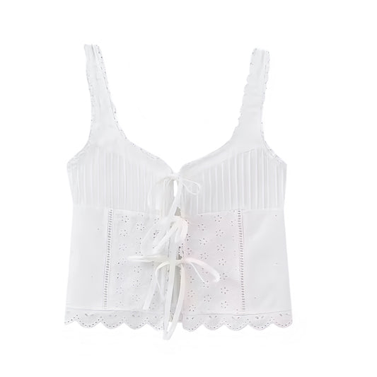 White embroidery lace trim hollow-out bow tied tank top with slim fit corset bustier silhouette. Eyelet floral embroidered scalloped detailing with square neckline and split neck. Sleeveless linen spaghetti strap backless crop camisole blouse. Women’s and teens’ summer and fall 2025 fashion. Feminine chic coquette Y2K trendy milkmaid vintage retro western everyday casual style. Perfect for holiday, vacation, party, night out, sexy club wear, beach, boho chic, bohemian, euro summer, Stockholm style