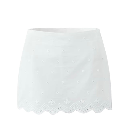 White embroidery lace trim slim fit high rise mini skirt with bodycon pencil silhouette. Floral eyelet embroidered scalloped lace detailing in feminine elegant style. Short skirt for women and teens in summer and fall 2025 fashion. Chic coquette Y2K trendy milkmaid vintage retro western everyday casual wear. Perfect for holiday, vacation, school, sorority rush, evening, party, night out, going out, sexy club wear, beach, boho chic, bohemian, euro summer, Stockholm style, Mediterranean Greece coastal style.