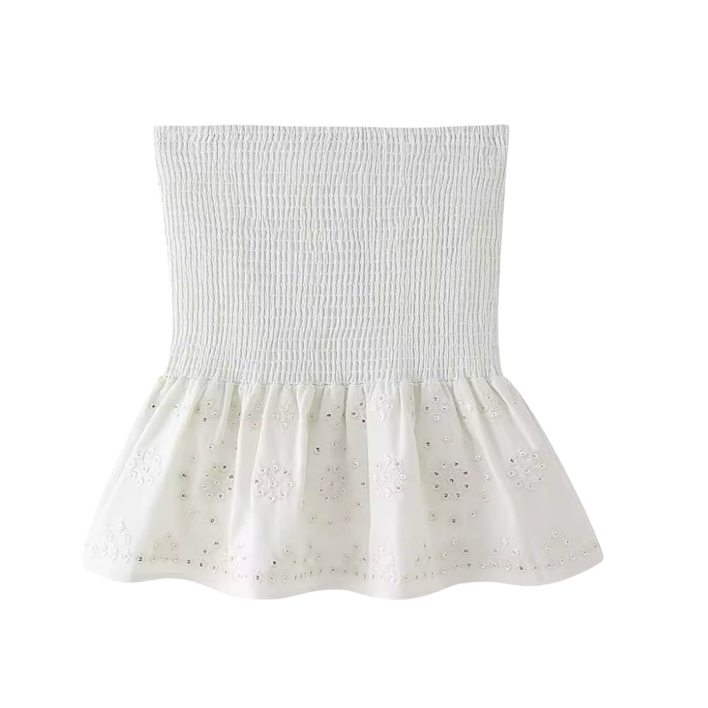White embroidery sequin embellished boho smocked ruffle trim mini skirt for women, teens, and ladies. Slim fit embroidered linen skirt with floral and geometric crochet patterns, sequin detailing, high-rise drop waist, layered ruffle trim, pleated tiered flared design, and flowy peplum silhouette. Perfect for 2025 summer holidays, vacations, casual everyday fashion, chic coastal granddaughter style, boho chic, Ibiza beachwear, Euro summer, Stockholm fashion, Greece resort wear, vintage retro and western.