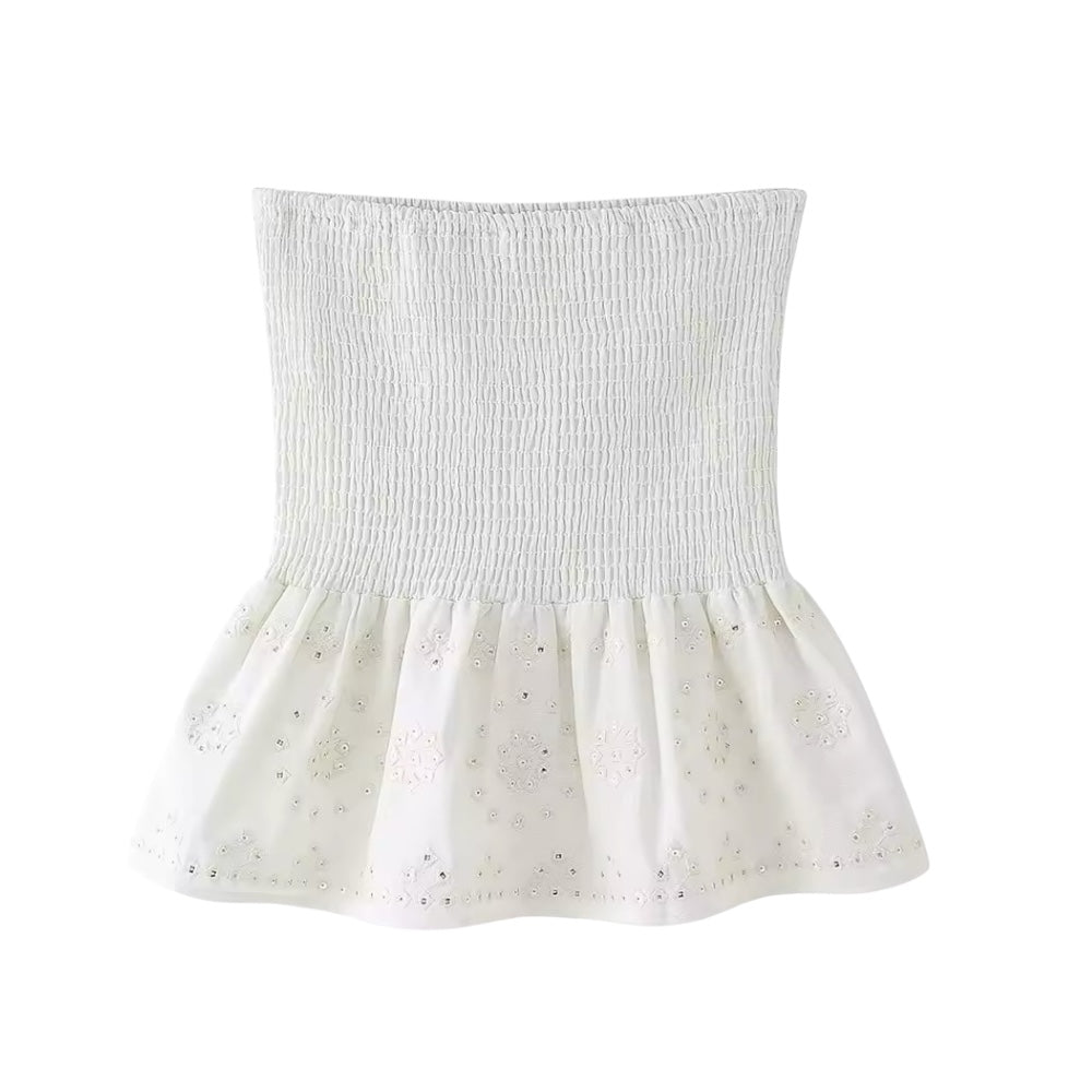 White embroidery sequin embellished boho smocked ruffle trim mini skirt for women, teens, and ladies. Slim fit embroidered linen skirt with floral and geometric crochet patterns, sequin detailing, high-rise drop waist, layered ruffle trim, pleated tiered flared design, and flowy peplum silhouette. Perfect for 2025 summer holidays, vacations, casual everyday fashion, chic coastal granddaughter style, boho chic, Ibiza beachwear, Euro summer, Stockholm fashion, Greece resort wear, vintage retro and western.