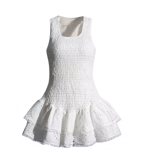 White eyelet embroidered layered ruffle smocked sleeveless mini dress with square neckline, scalloped crochet anglaise details, slim fit bodycon silhouette, tiered flared ruffle skirt, chic boho sundress for women and teens. Elegant and trendy Euro Summer vacation dress perfect for Ibiza style, beach club, brunch, party, sorority rush, prom, homecoming, graduation, wedding guest, or evening wear. Ships worldwide globally to USA, Australia, UK, Canada, Germany, France, Italy, Spain, Denmark, Europe