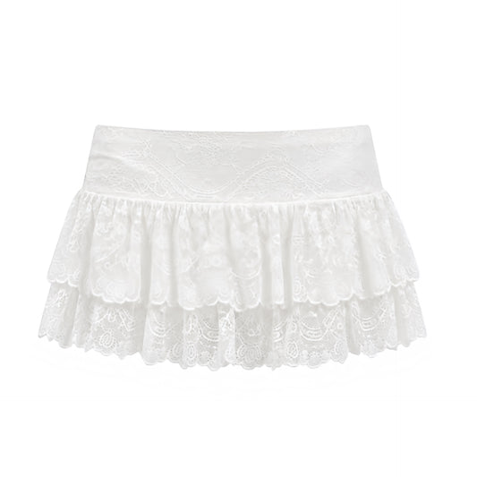White floral lace low-rise layered ruffle micro skort with lace trim, drop waist, ruffle trim, tiered layered ruffles, flared flowy silhouette, ultra short mini skirt and built-in micro shorts. Y2K 2000s fashion, coquette, dollette, baddie, fairycore, gypsycore, boho chic, Ibiza, festival, clubwear, streetwear, western chic and worldwide shipping.