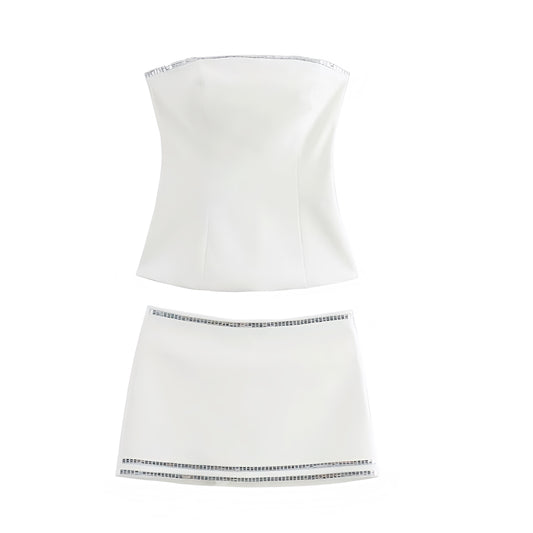 White slim fit sequin embellished strapless tube top and mini skirt matching 2 piece set. Strapless bandeau bustier corset style slim fit bodycon silhouette sleeveless backless short mini dress outfit. Women’s and teens’ summer and fall 2025 fashion. Sexy chic trendy Y2K style for sorority, rush, casual everyday wear, party, night out, club wear, rave, festival, concert, Ibiza style, boho chic, Stockholm style, street wear, dance, formal, homecoming, hoco, graduation. Ships worldwide to USA, AU, Europe 