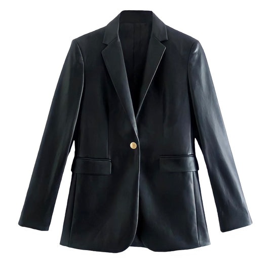 Black faux leather tailored blazer jacket for women featuring long sleeves, single-breasted button-down front, structured silhouette, v-neckline, and satin-lined interior. Oversized and elegant fall or winter outerwear perfect for casual, trendy, or chic streetwear looks. Inspired by minimalist, clean girl, and old money fashion aesthetics. Ships globally to US, UK, Canada, Europe, Asia, and Australia.